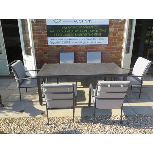 13 - A Bramblecrest all weather aluminium garden table with a glass top and 6 aluminium armchairs with cu... 