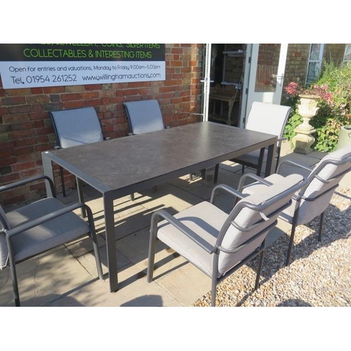 13 - A Bramblecrest all weather aluminium garden table with a glass top and 6 aluminium armchairs with cu... 
