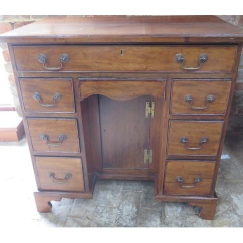 14 - A Georgian style mahogany 8 drawer lowboy desk with a cupboard, 82cm tall x 83cm x 50cm, some scratc... 