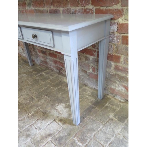 16 - A painted 3 drawer side table 135cm wide x 46cm deep x 75cm high