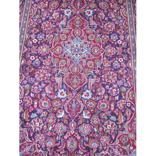 208 - A hand knotted woollen Karajeh rug, 2.15m x 1.35m