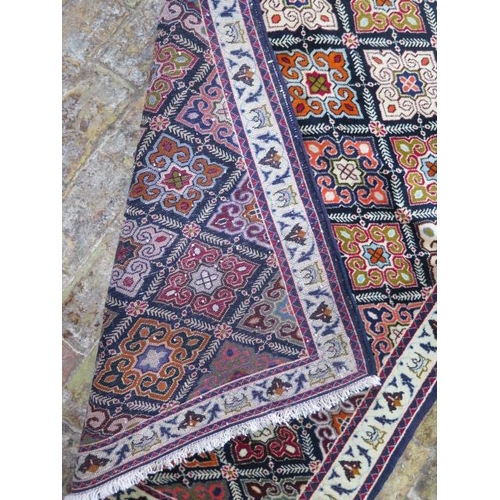 209 - A hand knotted woollen Baluchi rug, 1.45m x 1.10m