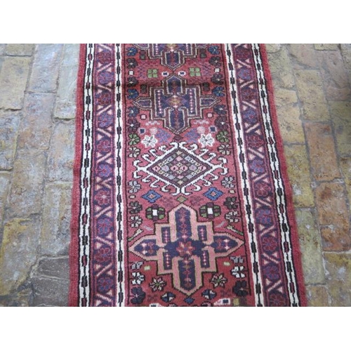 212 - A hand knotted woollen Karajeh rug, 2.82m x 1.72m