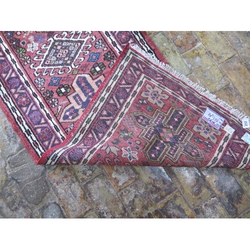 212 - A hand knotted woollen Karajeh rug, 2.82m x 1.72m