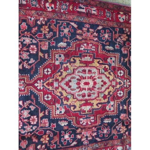 213 - A hand knotted woollen Hamadan rug, 2.10m x 1.36m