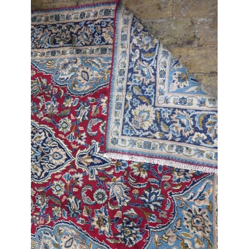 215 - A hand knotted woollen Isphihan rug, 2.40m x 1.30m