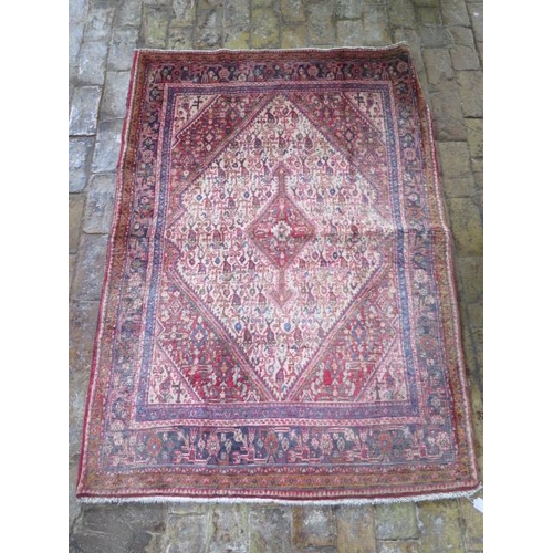 217 - A hand knotted woollen Senneh rug, 1.50m x 1.10m