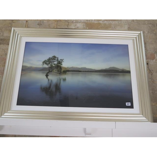 227 - A silver framed highland loch scene, frame size 74cm x 105cm