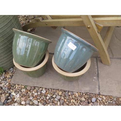 27B - Four small glazed frost proof pots, 22cm diameter
