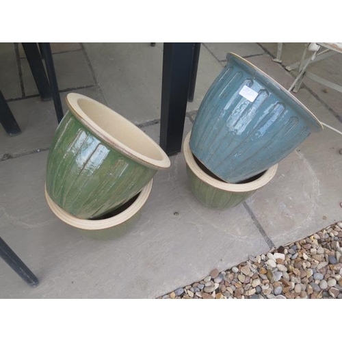 27D - Four medium glazed frost proof pots, 26cm diameter