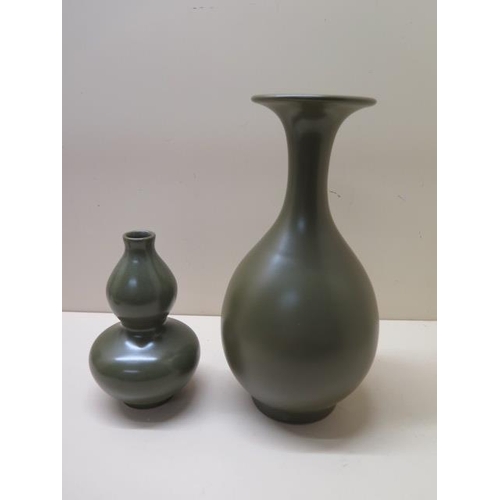 296 - A Chinese green glaze vase 25cm tall and a Chinese green glaze double gourd vase 15cm tall, both goo... 