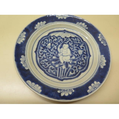 297 - A Chinese blue and white plate 21cm wide and a small dragon crackle glaze stand, both good condition