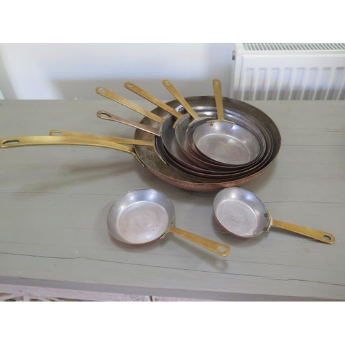 305 - A set of 9 vintage copper pans