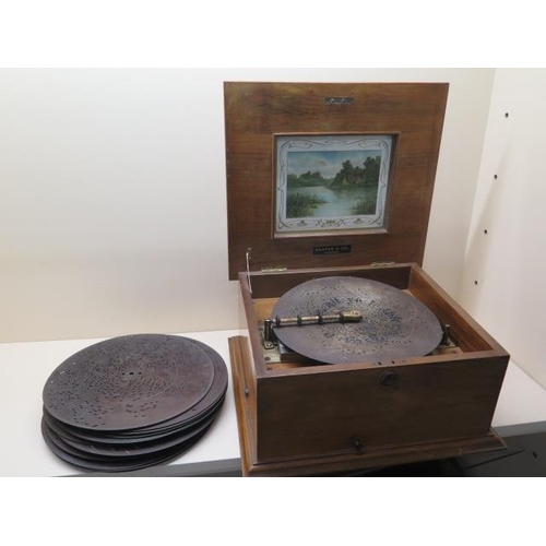 309 - A 19th century Polyphon with 22 discs, in working order