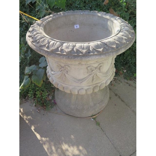 31 - A stone effect urn on stand, 63cm high x 63cm wide, in good condition