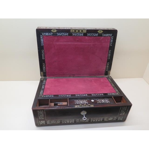 310 - A 19th century rosewood with mother of pearl writing box with its key