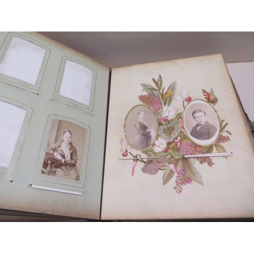 326 - A Victorian musical clasped photograph album with 13 floral designed leaves showing 5 cabinet photog... 