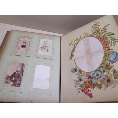 326 - A Victorian musical clasped photograph album with 13 floral designed leaves showing 5 cabinet photog... 