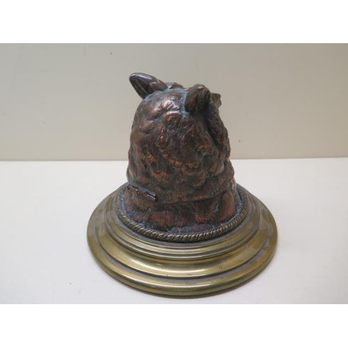 327 - A copper and brass owls head desk inkwell, 13cm tall, with original glass insert, small chips to ins... 