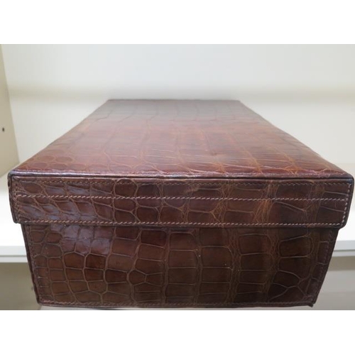 331 - A good quality early 20th century crocodile skin leather suitcase in good polished condition, recent... 