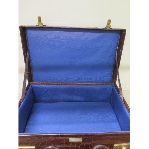 331 - A good quality early 20th century crocodile skin leather suitcase in good polished condition, recent... 