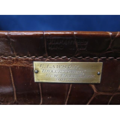 331 - A good quality early 20th century crocodile skin leather suitcase in good polished condition, recent... 