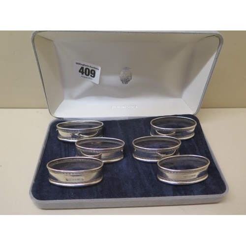 409 - A boxed set of 6 silver serviette rings, total weight approx 1.5 troy oz, all good, no engraving