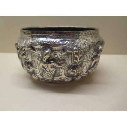 412 - Two embossed Eastern white metal bowls 9cm and 7cm tall, total approx 14.3 troy oz, some denting but... 