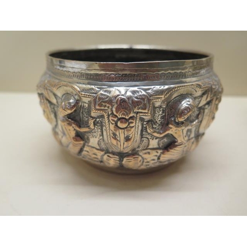 412 - Two embossed Eastern white metal bowls 9cm and 7cm tall, total approx 14.3 troy oz, some denting but... 