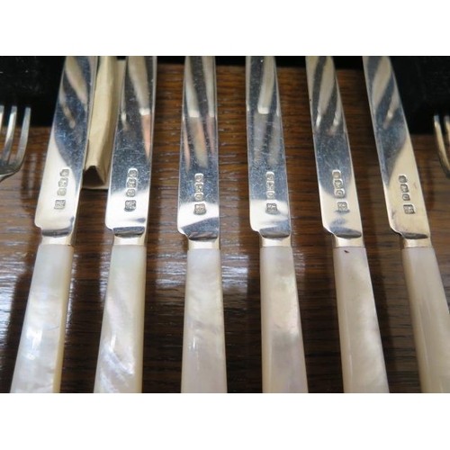 413 - Two boxed sets of 6 and 12 silver Mother of pearl fruit knives and forks, all good condition, some w... 