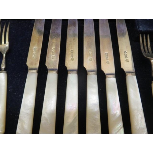 413 - Two boxed sets of 6 and 12 silver Mother of pearl fruit knives and forks, all good condition, some w... 