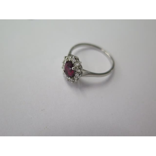 475 - A 9ct white gold garnet and diamond ring, size P/Q, approx 2.5 grams, head 11mm x 9mm, in good condi... 