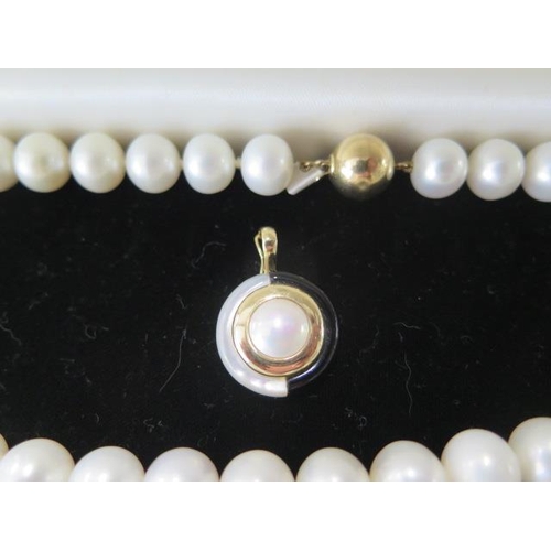 479 - A string of pearls 41cm long with a 9ct clasp, each pearl approx 10mm x 8mm, with a pear pendant 2cm... 