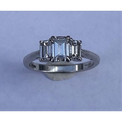 484 - A hallmarked Tiffany & Co 950 platinum 3 stone baguette cut diamond ring, the central diamond approx... 