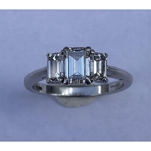 484 - A hallmarked Tiffany & Co 950 platinum 3 stone baguette cut diamond ring, the central diamond approx... 