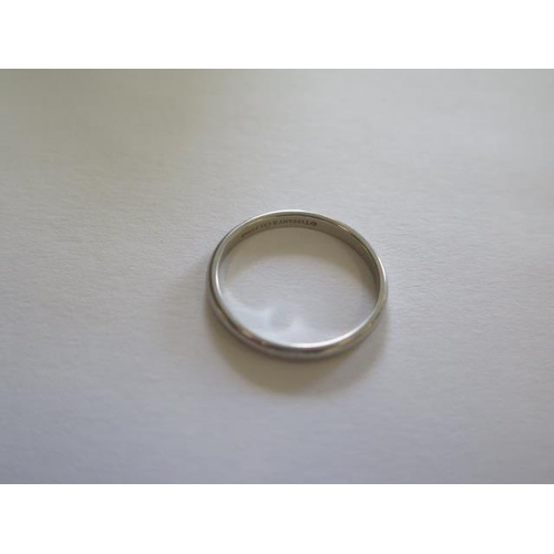 485 - A hallmarked Tiffany & Co 950 platinum band ring, size M, approx 2.7 grams, some small usage marks, ... 