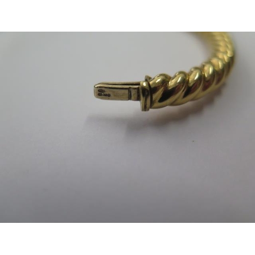 491 - A hallmarked 18ct 750 rope twist hinged bangle, 7cm x 6cm external, approx 31.8 grams, good conditio... 