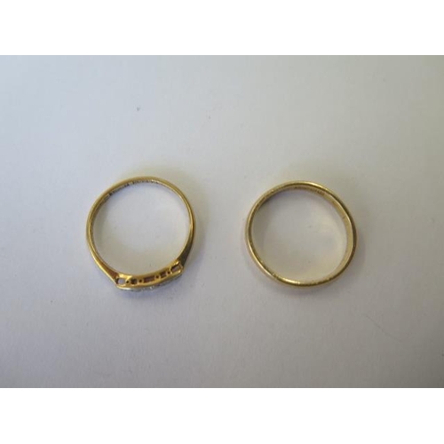 493 - An 18ct yellow gold hallmarked band ring, size K/L, and an 18ct yellow gold ring set with diamond ch... 