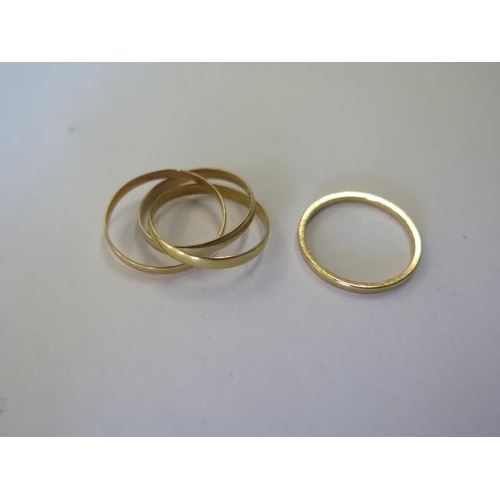 494 - A 9ct yellow gold band ring, size N, and a 9ct triple band ring, size L, total approx 2.7 grams