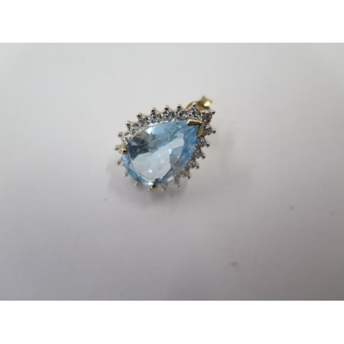 500 - A 9ct yellow and white gold pear shaped ring possibly blue topaz, size L, with a matching pair of ea... 