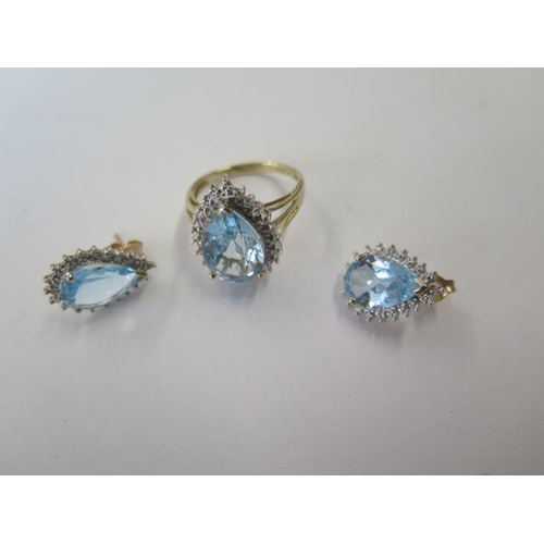 500 - A 9ct yellow and white gold pear shaped ring possibly blue topaz, size L, with a matching pair of ea... 