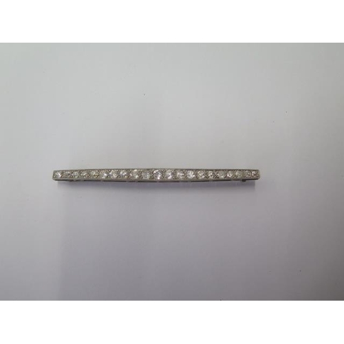 502 - A diamond 21 stone white metal brooch possibly platinum, 7.2cm long, approx 5.5 grams, diamonds brig... 