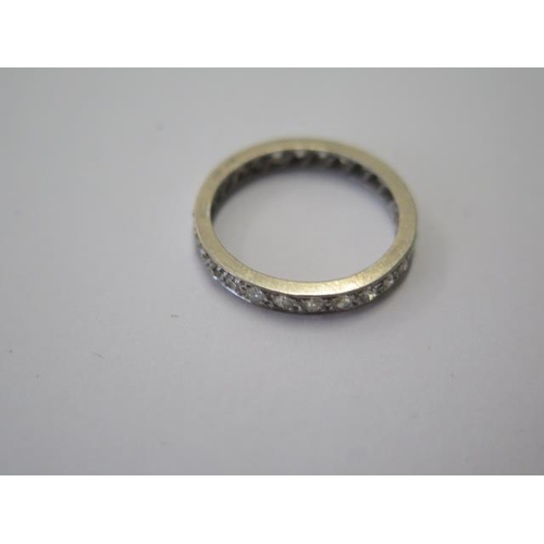 505 - A hallmarked 18ct white gold diamond eternity ring, size N, approx 2.6 grams, generally good