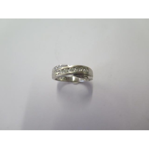 A 9ct white gold seven stone diamond ring, approx 0.25ct, size L, approx 3.7 grams, generally good