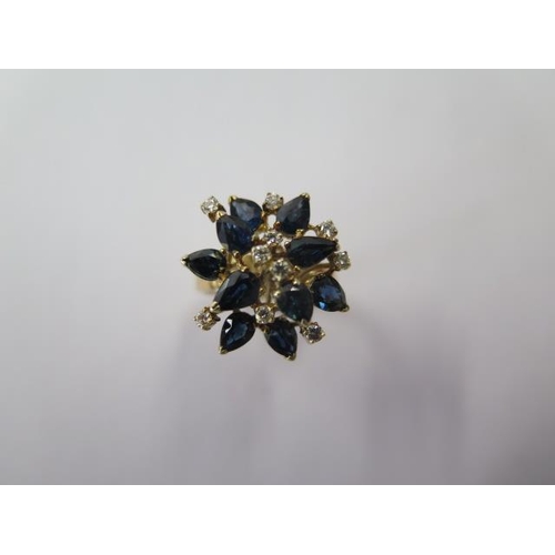 516 - A 14ct yellow gold sapphire and diamond cluster ring, size M/N, head approx 20mm wide, approx 6.4 gr... 