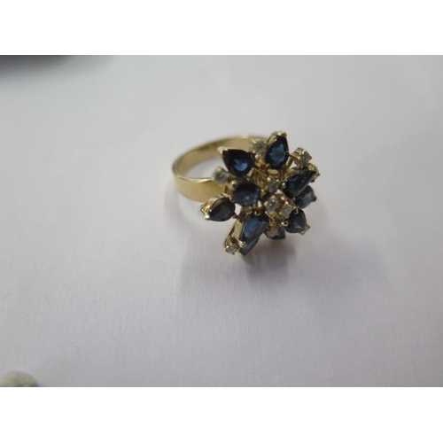 516 - A 14ct yellow gold sapphire and diamond cluster ring, size M/N, head approx 20mm wide, approx 6.4 gr... 