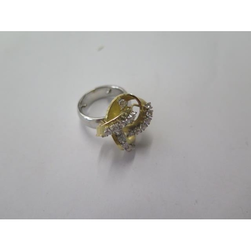 523 - An unusual white and yellow gold diamond set knot ring, set with 20 round brilliant diamonds, total ... 