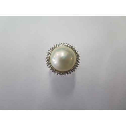 526 - A 14ct white gold pearl and diamond ring, head approx 18mm, with spacers making it size L, approx 5.... 