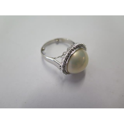 526 - A 14ct white gold pearl and diamond ring, head approx 18mm, with spacers making it size L, approx 5.... 