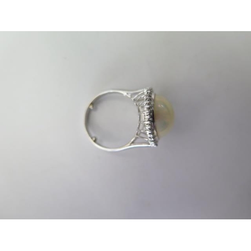 526 - A 14ct white gold pearl and diamond ring, head approx 18mm, with spacers making it size L, approx 5.... 